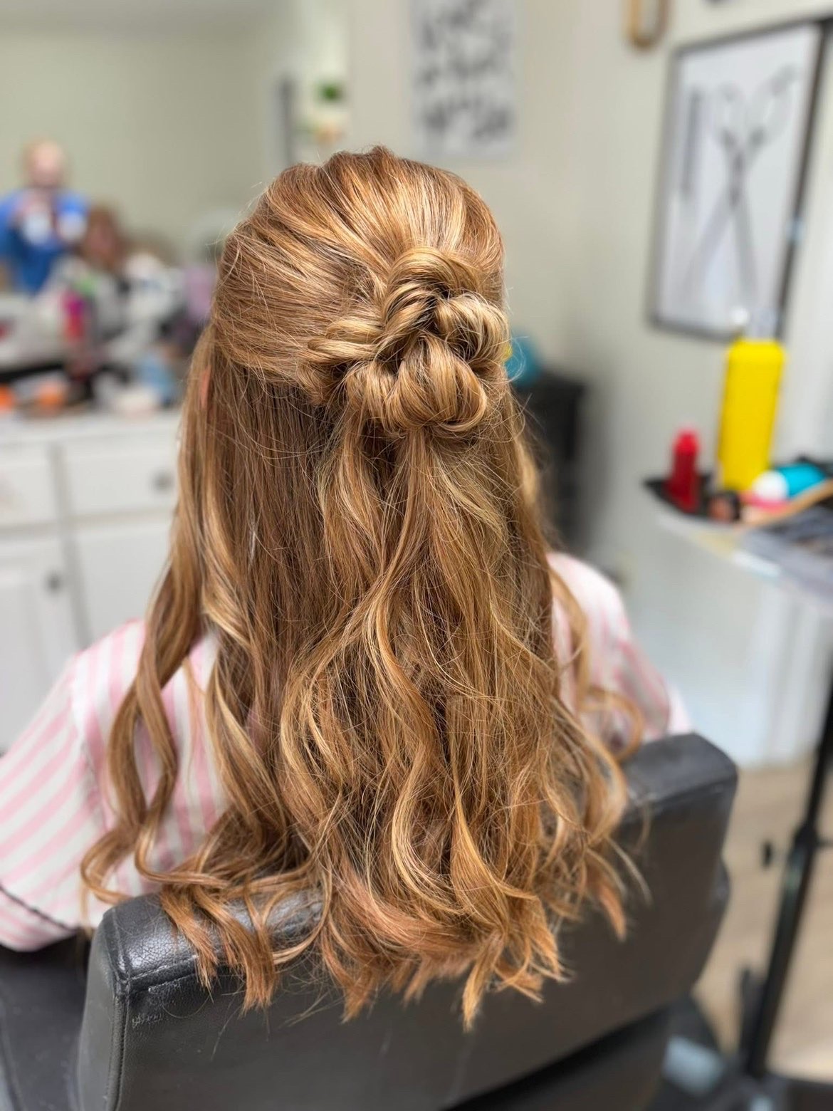 Half-up bridal bun with soft honey tones